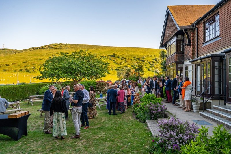 Family and friends gathering in the gardens at Tottington Manor for a celebration of life