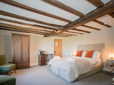 Boutique guest bedroom at Tottington Manor for relatives attending a funeral in West Sussex