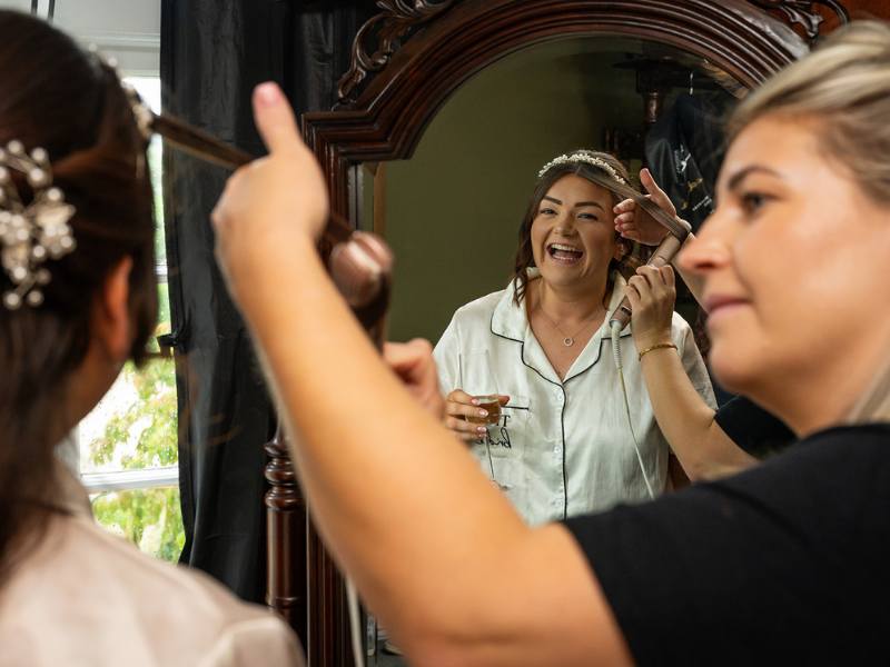 Having your hair done on your wedding day in our getting ready room at Tottington Manor