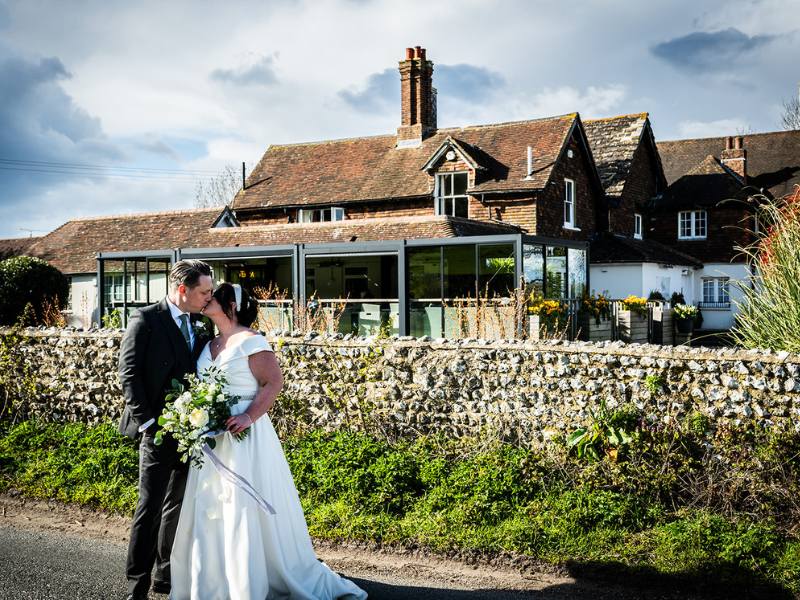  Couple Celebrating their Intimate Wedding outside Tottington Manor near Hassocks